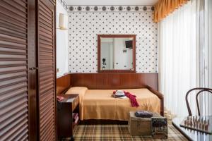 Postel nebo postele na pokoji v ubytování Hotel Astro