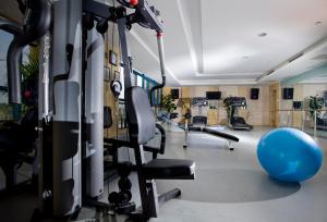 a gym with a bunch of treadmills and machines at Yiwu Ocean Hotel - Original Best Western Premier Ocean Hotel in Yiwu
