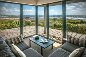 a living room with a view of the ocean at Cottage 215 - Claddaghduff in Cleggan