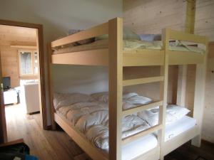 Voodi või voodid majutusasutuse Chalet Valaisia toas