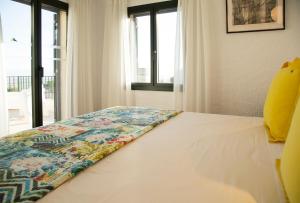 Ein Bett oder Betten in einem Zimmer der Unterkunft Torre Orquidaceae - Plus Costa Brava