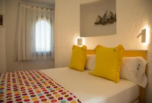 Ein Bett oder Betten in einem Zimmer der Unterkunft Torre Orquidaceae - Plus Costa Brava