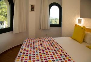 Ein Bett oder Betten in einem Zimmer der Unterkunft Torre Orquidaceae - Plus Costa Brava