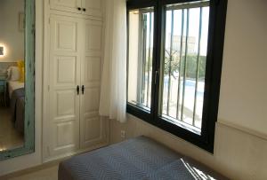Ein Bett oder Betten in einem Zimmer der Unterkunft Torre Orquidaceae - Plus Costa Brava
