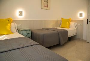 Ein Bett oder Betten in einem Zimmer der Unterkunft Torre Orquidaceae - Plus Costa Brava