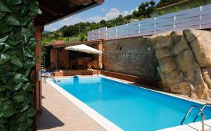 a large swimming pool next to a building at B&B Villa Maria in Agropoli