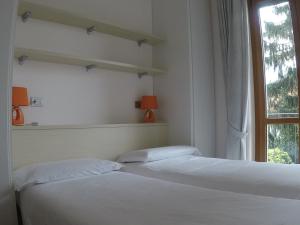 Postel nebo postele na pokoji v ubytování Vittoria Residence