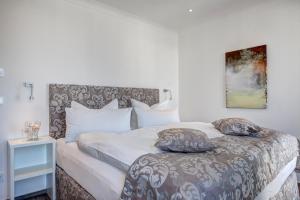 Llit o llits en una habitació de Aparthotel Villa Lea