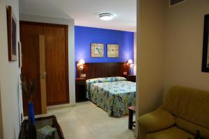 Voodi või voodid majutusasutuse Hotel Rocio toas