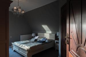 Posteľ alebo postele v izbe v ubytovaní Góralski Dwór