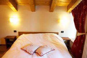 Posteľ alebo postele v izbe v ubytovaní Le Petit Coeur Residence De Montagne