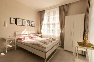 A bed or beds in a room at ATICI HOTEL