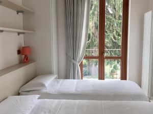 Postel nebo postele na pokoji v ubytování Vittoria Residence