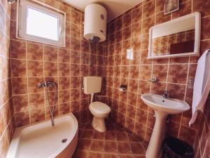 Koupelna v ubytování Apartmani Lasta