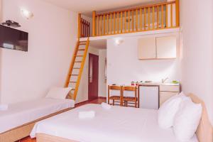 Postel nebo postele na pokoji v ubytování Apartmani Lasta