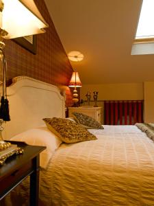 a bedroom with a bed with two pillows on it at Casa Miñón in Buera