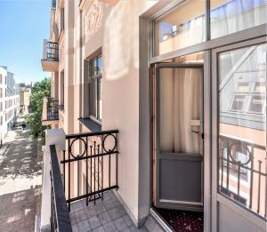 a balcony with a door to a building at Rixwell Old Riga Palace Hotel in Rīga