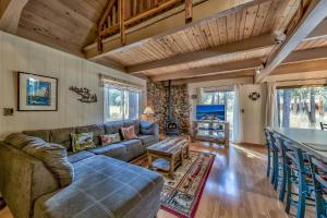 a living room with a couch and a table at 1625A Atroari Chalet in South Lake Tahoe