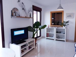 TV a/nebo společenská místnost v ubytování Ático El Rinconcillo
