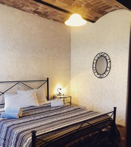 Giường trong phòng chung tại Podere Scopaione