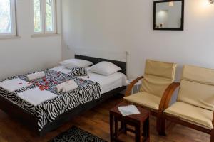 Posteľ alebo postele v izbe v ubytovaní Dino and Jele Apartments