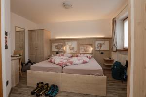 Posteľ alebo postele v izbe v ubytovaní Albergo Aurora
