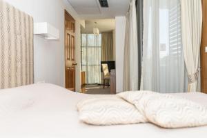 Postel nebo postele na pokoji v ubytování Hotel Burgas