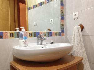 a bathroom with a white sink and a mirror at El Salat, alojamientos rurales in Guadalest +48 photos