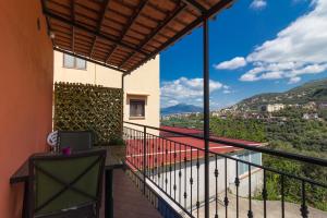 a balcony with a view of the mountains at Casale Ceppone in Vico Equense