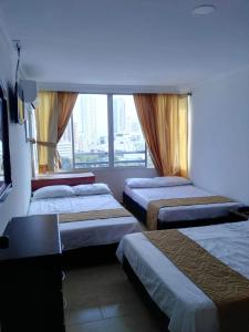 Postel nebo postele na pokoji v ubytování Apartamento 1101 Edificio Nuevo Conquistador