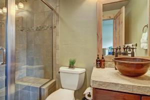 a bathroom with a sink and a toilet and a shower at 39C Union Creek Townhomes West Townhouse in Copper Mountain
