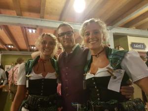 a man and two women posing for a picture at Landgasthof zur Goldenen Traube in Podersdorf am See