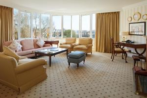 a living room with a couch and chairs and a table at Cheval Thorney Court at Hyde Park in London