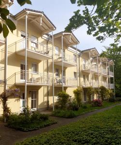 an exterior view of a building with balconies at Apartmenthaus Home24 in Chemnitz