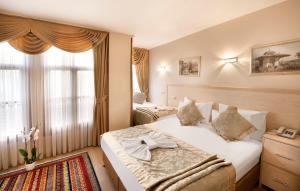מיטה או מיטות בחדר ב-Sultan House