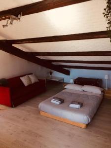a bedroom with a large bed in a attic at La mansardina in Padova