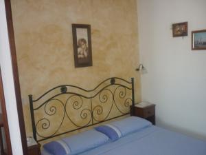 Postel nebo postele na pokoji v ubytování Albergo Vittoria + 37 fotografií