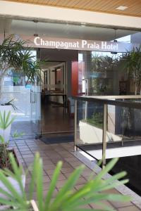 a sign for the entrance to the chippendale plaza hotel at Champagnat Praia Hotel in Vila Velha