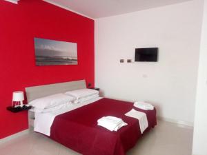 A bed or beds in a room at Casa Vacanza Miramare