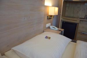 Postel nebo postele na pokoji v ubytování Hotel Lutter