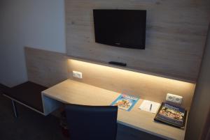 TV a/nebo společenská místnost v ubytování Hotel Lutter