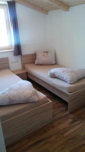 Un pat sau paturi într-o cameră la Naglerhof