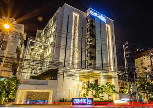 a building with a samsung sign on it at night at SN Connx - SHA Plus in Pattaya Central