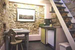 Kuchyň nebo kuchyňský kout v ubytování I Valloni Apartments