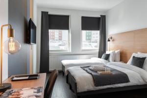 Postel nebo postele na pokoji v ubytování 201 Hotel