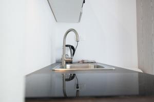 Kuchyň nebo kuchyňský kout v ubytování Akrogiali Apartments