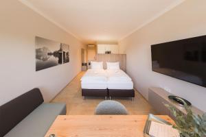 Postel nebo postele na pokoji v ubytování TT Aparthotel Neuhofen