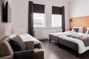 Postel nebo postele na pokoji v ubytování 201 Hotel