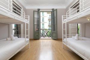 Postel nebo postele na pokoji v ubytování Key Barcelona HOUSING (Carrer Girona)