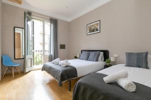 Postel nebo postele na pokoji v ubytování Key Barcelona HOUSING (Carrer Girona)